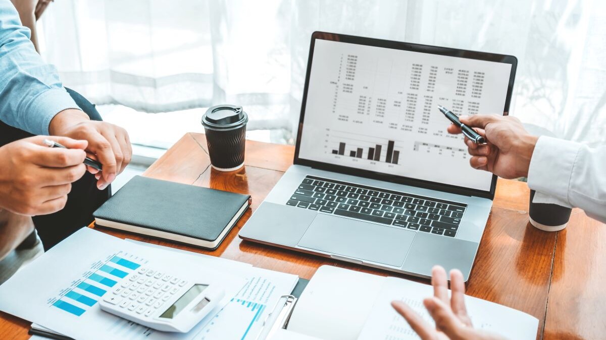 Business team meeting Strategy Planning with new startup project plan Finance and Economy Graph with laptop successful teamwork