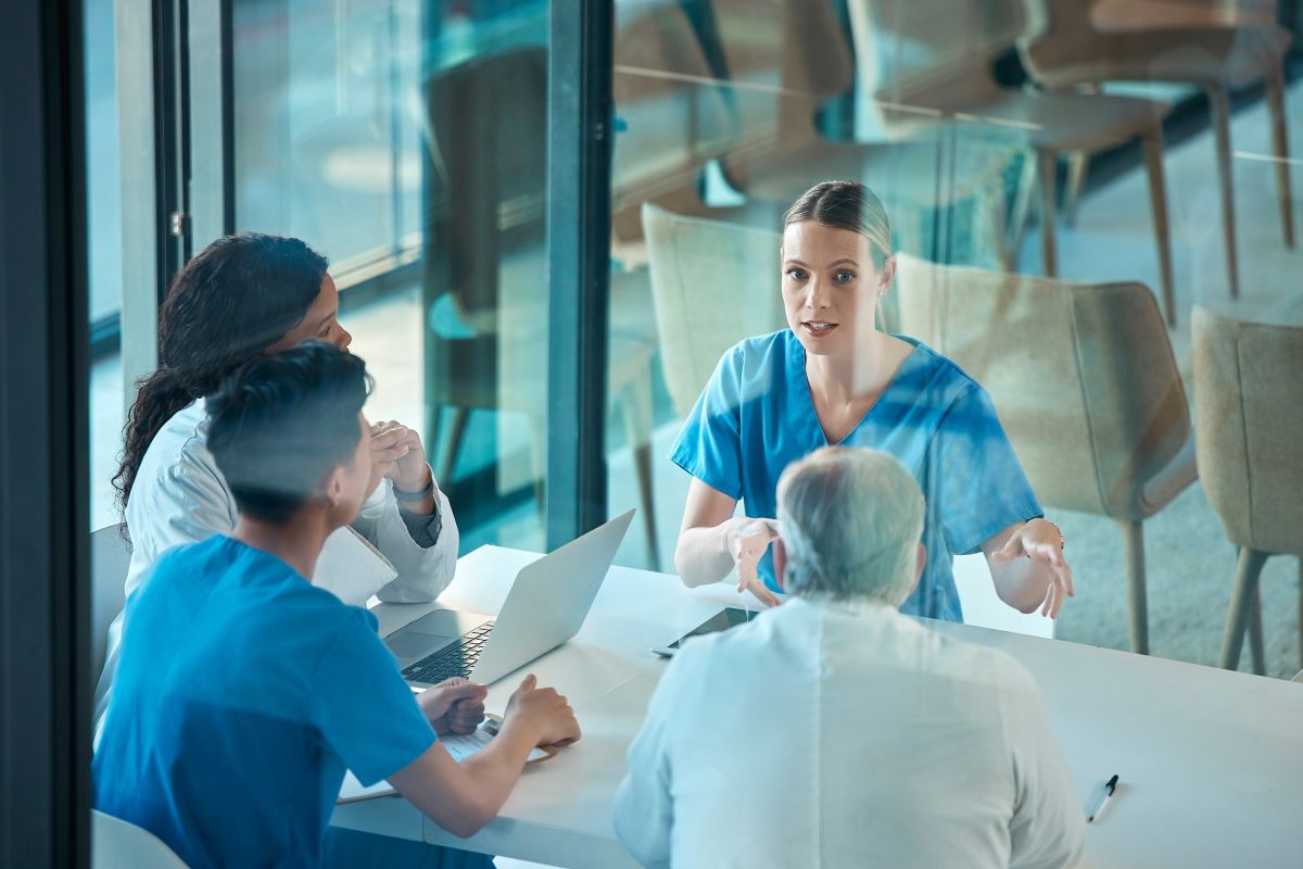Medical team, doctors and meeting with a laptop for a discussion